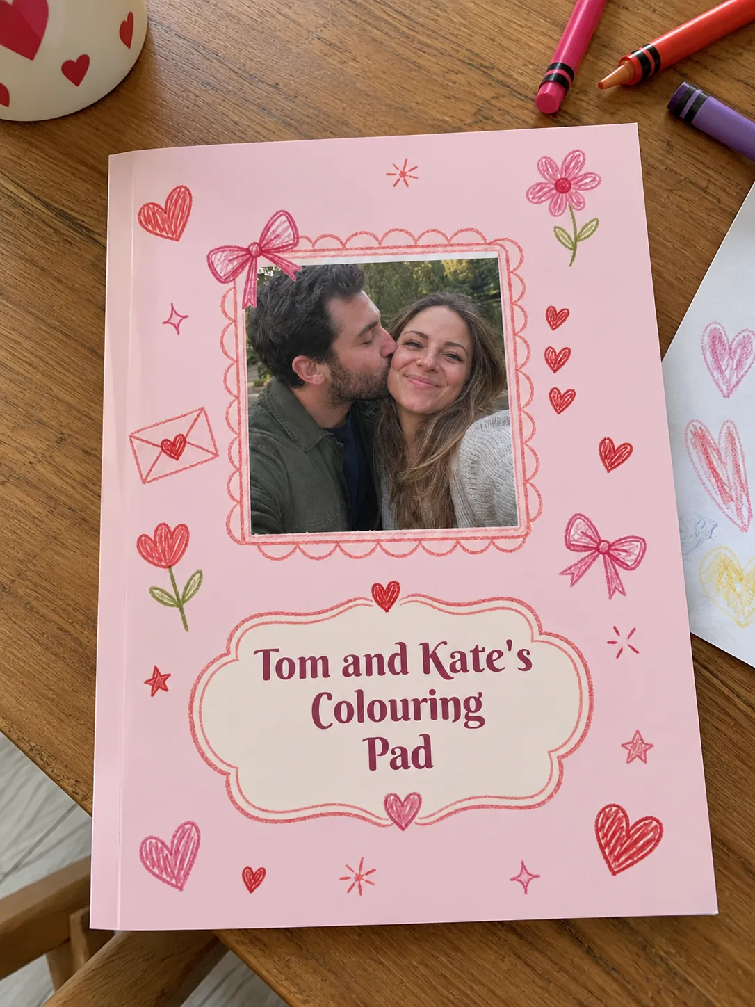 Love personalised colouring book example photographed on a table