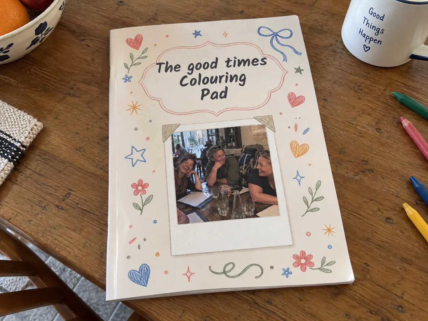 Memories personalised colouring book example photographed on a table
