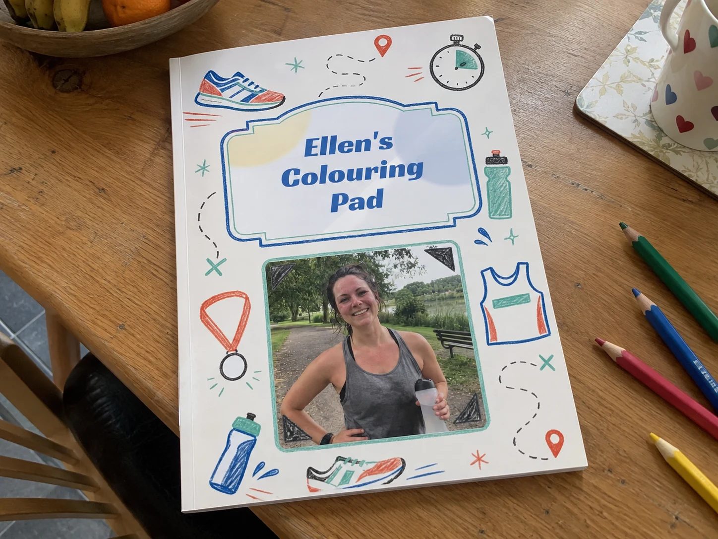 Running personalised colouring book example photographed on a table